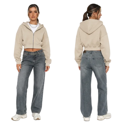 Front and back view of a model wearing a beige cropped zip hoodie and baggy vintage wash denim jeans for a Y2K streetwear outfit.