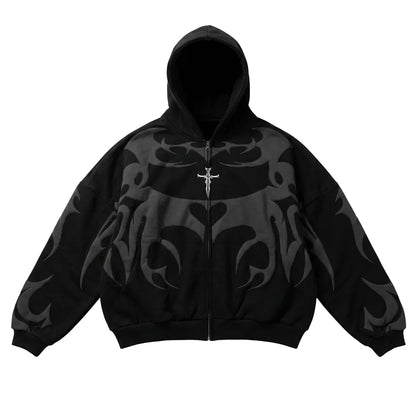 Oversized black full-zip hoodie with dark grey tribal graphics and a silver cross embroidery for a Y2K streetwear style.