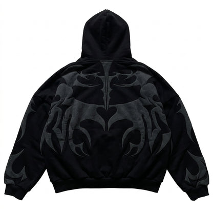 Back view of an oversized black full-zip hoodie with dark grey tribal graphic patterns for a Y2K streetwear style.