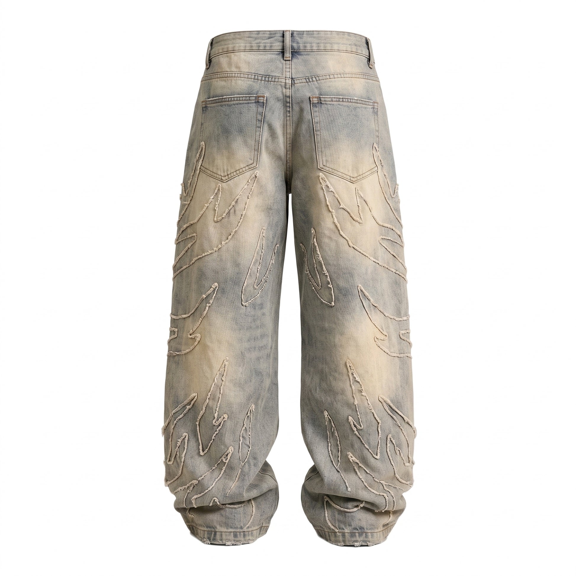 Back view of baggy light wash denim jeans featuring flame patch details and a wide-leg silhouette in a Y2K streetwear style.