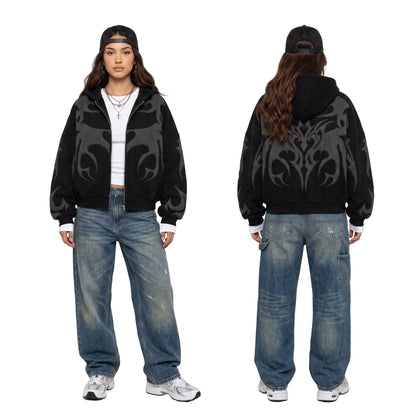 Front and back view of a model wearing a black graphic zip hoodie and baggy vintage wash denim jeans for a Y2K streetwear look.